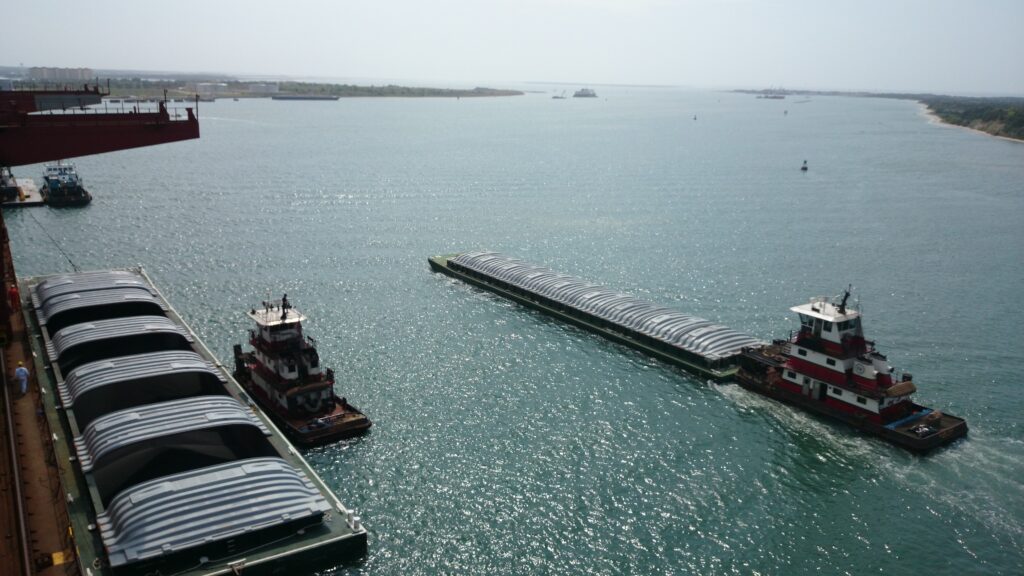 aerial shot of barges and tugboats